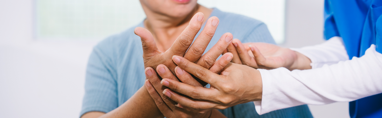 a nurse provides care to patient hand