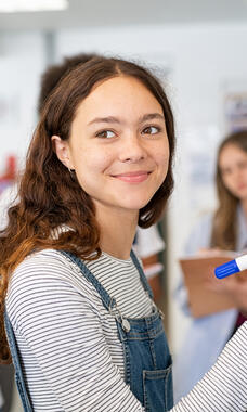 young teen at whiteboard