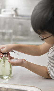 child washing hands