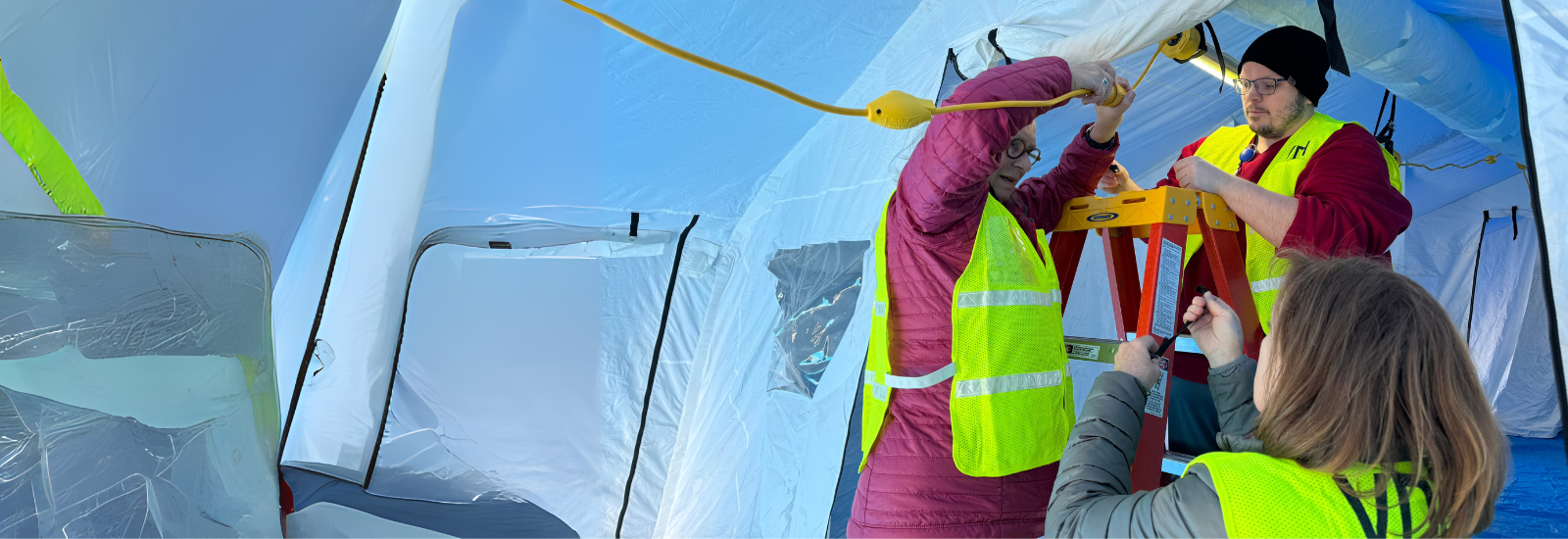 Medical Reserve Corp members constructing a mobile hospital clinic.