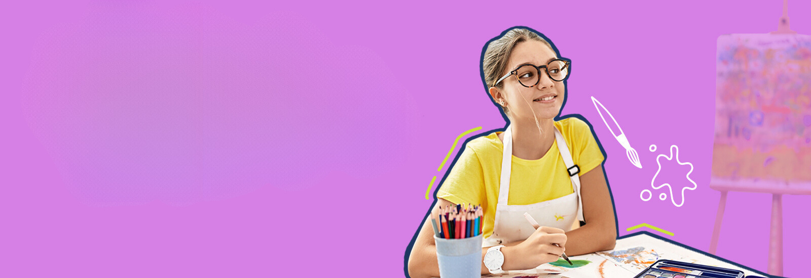 Adolescent girl with glasses wearing a smock while she paints.