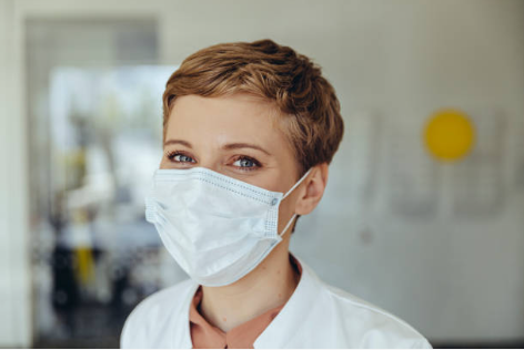 Provider in a hospital wearing a mask