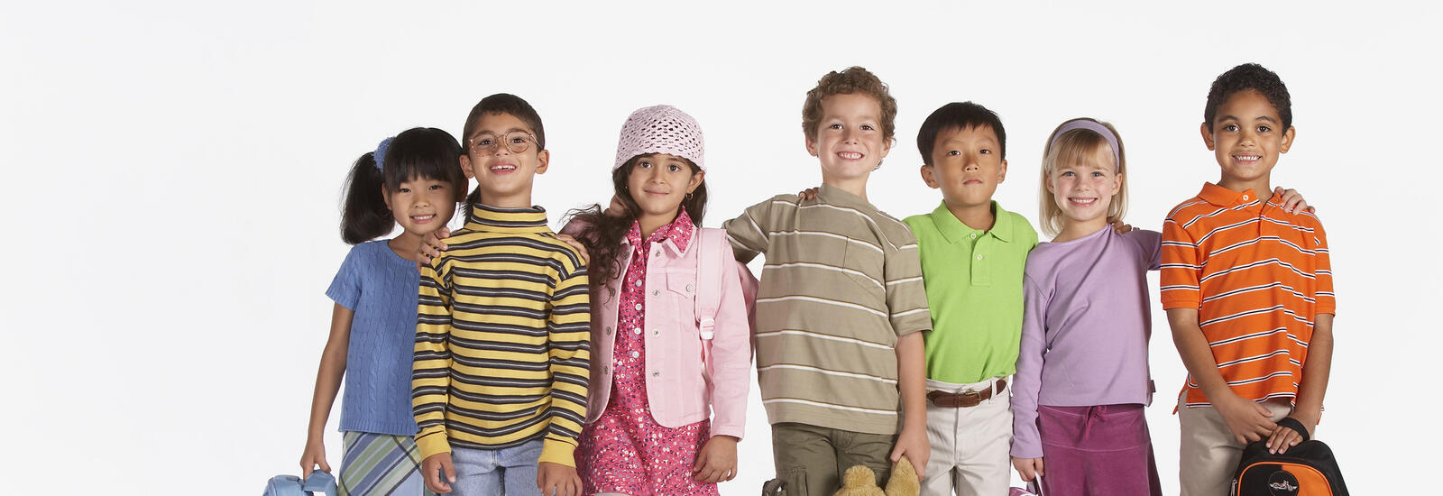 Kids standing in a row and ready for school.