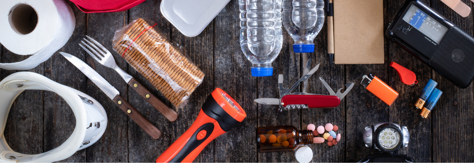 Emergency preparedness supplies, like water, flashlight, Swiss army knife and medications. 