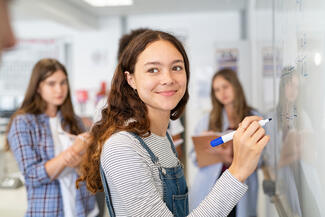 young teen at whiteboard